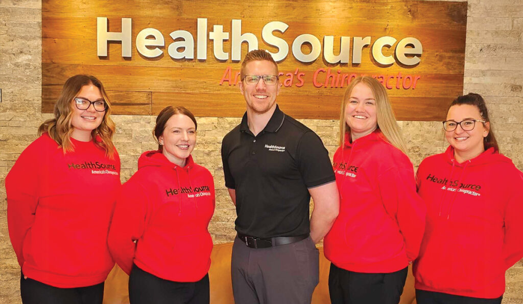 The HealthSource of Meridian team posing together inside the clinic.