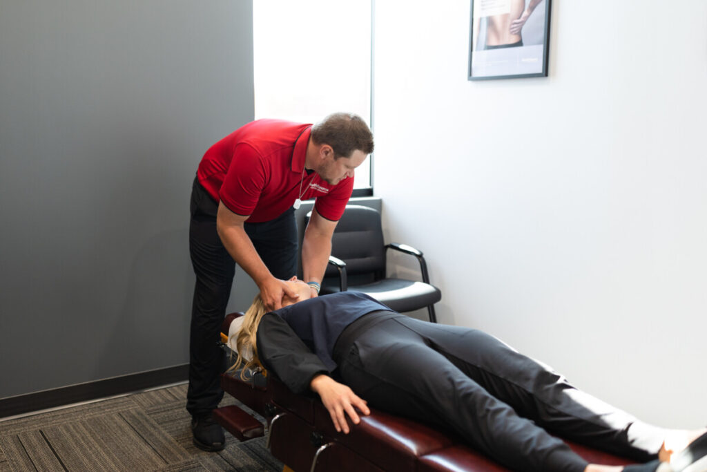 Dr. Mike adjusting a chiropractic patient at HealthSource of Albertville.